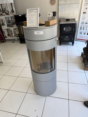 a stove in the middle of a room in a store