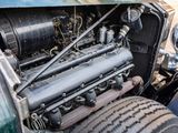 a close up of an old car engine with the hood up