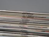 a lot of cds stacked on top of each other