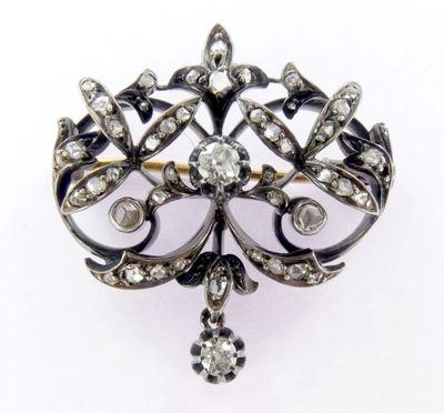 une image représentant une broche sertie de diamants sur un fond blanc