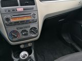 a dashboard of a car with a steering control