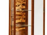 a wooden cabinet with a glass door and drawers