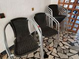three chairs that are sitting on a tiled floor