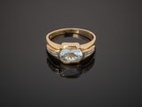 a gold ring with a blue topaz stone and diamonds