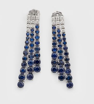 a pair of sapphire and diamond earrings