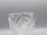 clear glass bowl on a white surface with a gray background