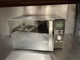 a microwave that is sitting on a counter in a kitchen