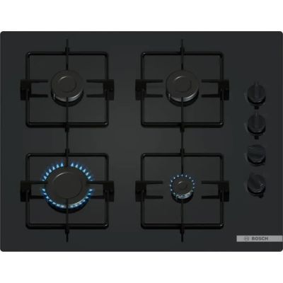 an image of a black gas stove with four burners and a blue flame