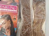 two packages of hair that are wrapped in plastic