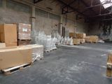 a large warehouse with a lot of boxes and pallets