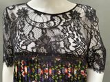 a black and white dress with a floral pattern on it