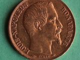 a close up of a coin with a man ' s face on it