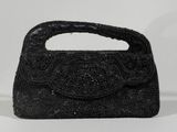 an image of a black beaded purse on a white background