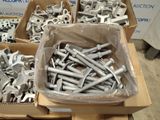 many boxes of different types of metal parts on a table