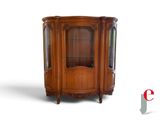 an image of a wooden corner cabinet with glass doors