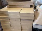 a pile of boxes on a pallet in a warehouse