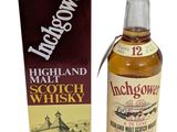 une bouteille de whisky de malt des Highlands à côté d'une boîte