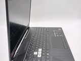 a black laptop with a black keyboard on a white surface