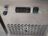 an image of a stainless steel cabinet with buttons and switches