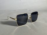 a pair of sunglasses sitting on top of a white surface