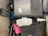 a pile of electronic equipment sitting on top of a yellow table