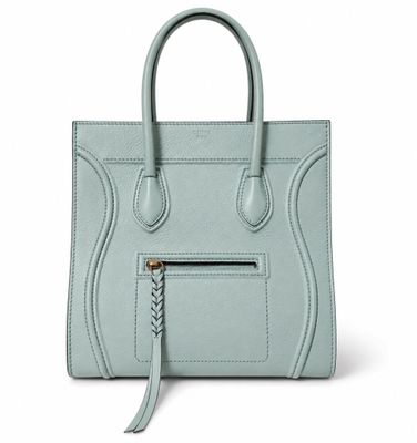 a light blue handbag with a zipper on the front