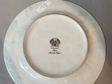 a white plate with a picture of a horse on it
