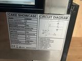 a picture of a machine that has a cake showcase on it