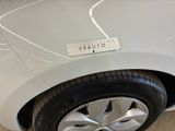 a white car with a sticker on the side of it