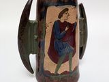 a brown mug with a picture of a man on it