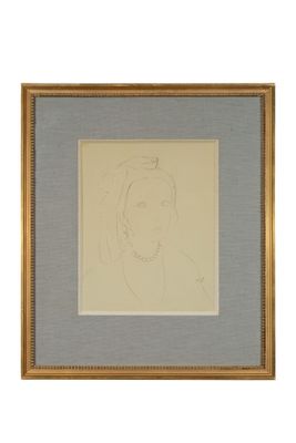 l'image d'un dessin d'un visage de femme dans un cadre doré
