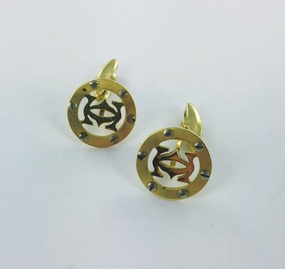 a pair of gold plated cufflinks with initials