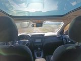 a view of the inside of a car from the driver ' s seat