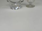 a glass and a glass of water on a table
