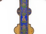 an ornately decorated cross on a white background with a blue background