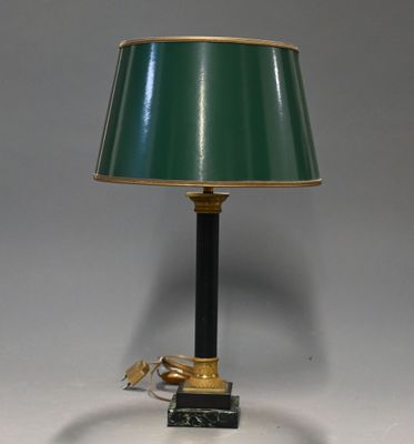 an image of a table lamp with a green shade on top of it