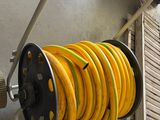 a hose and a hose reel attached to a wall