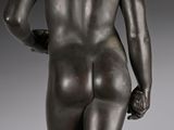 an image of a statue of a man with his back turned to the camera