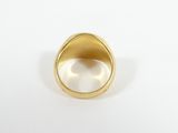 a close up of a gold ring on a white surface