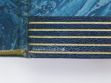 an image of a close up of a wallet with a blue and yellow stripe