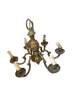 an image of a chandelier with five lights and a candle holder