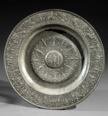 an image of a silver plate with a design on it
