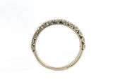 a close up of a diamond ring on a white background