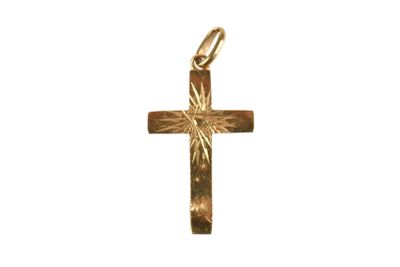 a close up of a gold cross on a white background