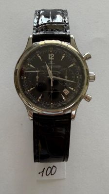 a watch that is on display on a white surface