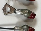 three different types of tools are sitting on a white surface