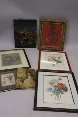 several framed and unframed pictures of flowers and birds on a table
