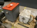 a small machine that is sitting on top of a pallet