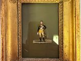 a picture of a man sitting on a bench in a picture frame