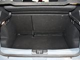 a trunk of a car with a seat folded open